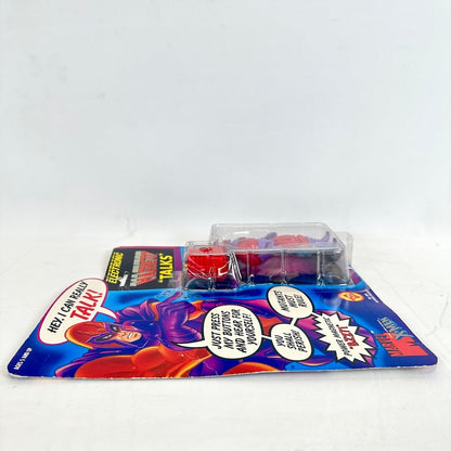 Toy figure in packaging with colorful design and text on a white background
