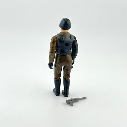 Toy figure of a soldier in military uniform with a rifle on a white background