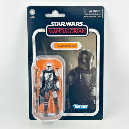 Star Wars action figure in its original blister card packaging, featuring The Mandalorian in silver armor. 