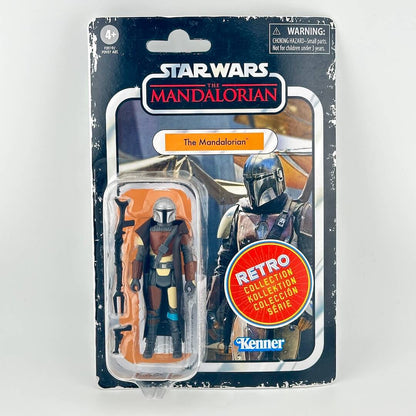 Star Wars action figure in its original blister packaging with figure in silver and brown armor with accessories. 