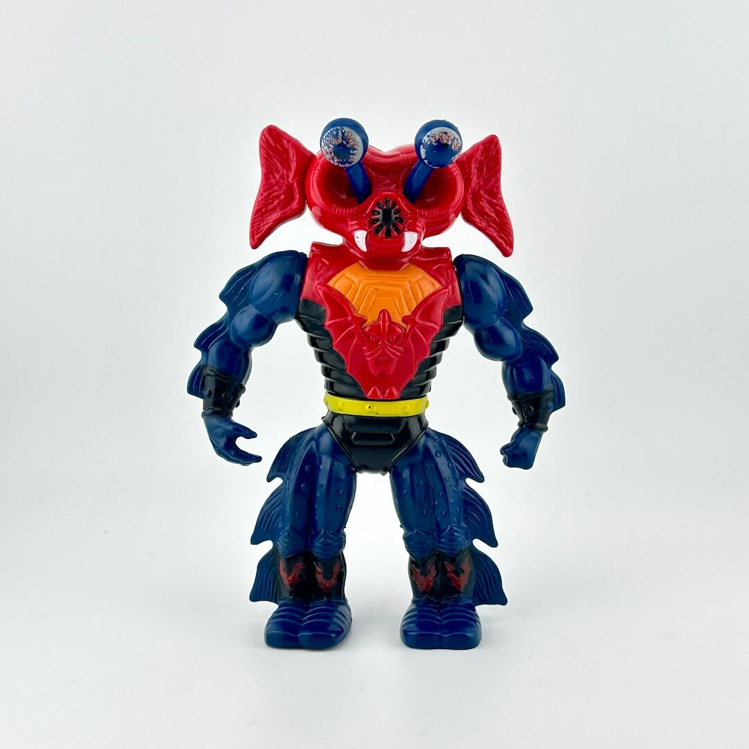 He-man action figure with blue body, a red head and red chest. 