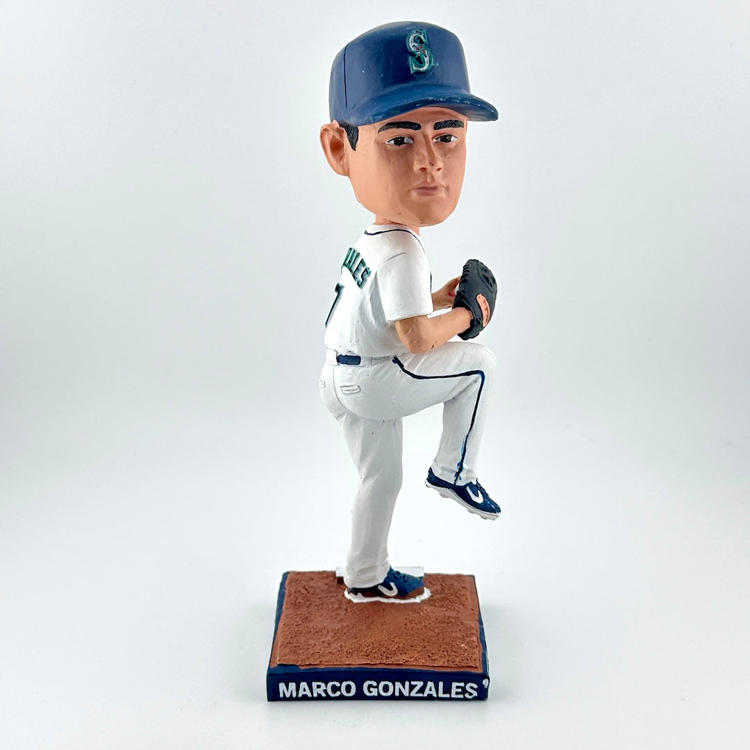 Bobblehead of a baseball player in a white uniform with a blue cap on a white background