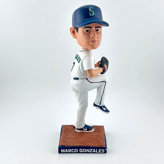 Bobblehead of a baseball player in a white uniform with a blue cap on a white background