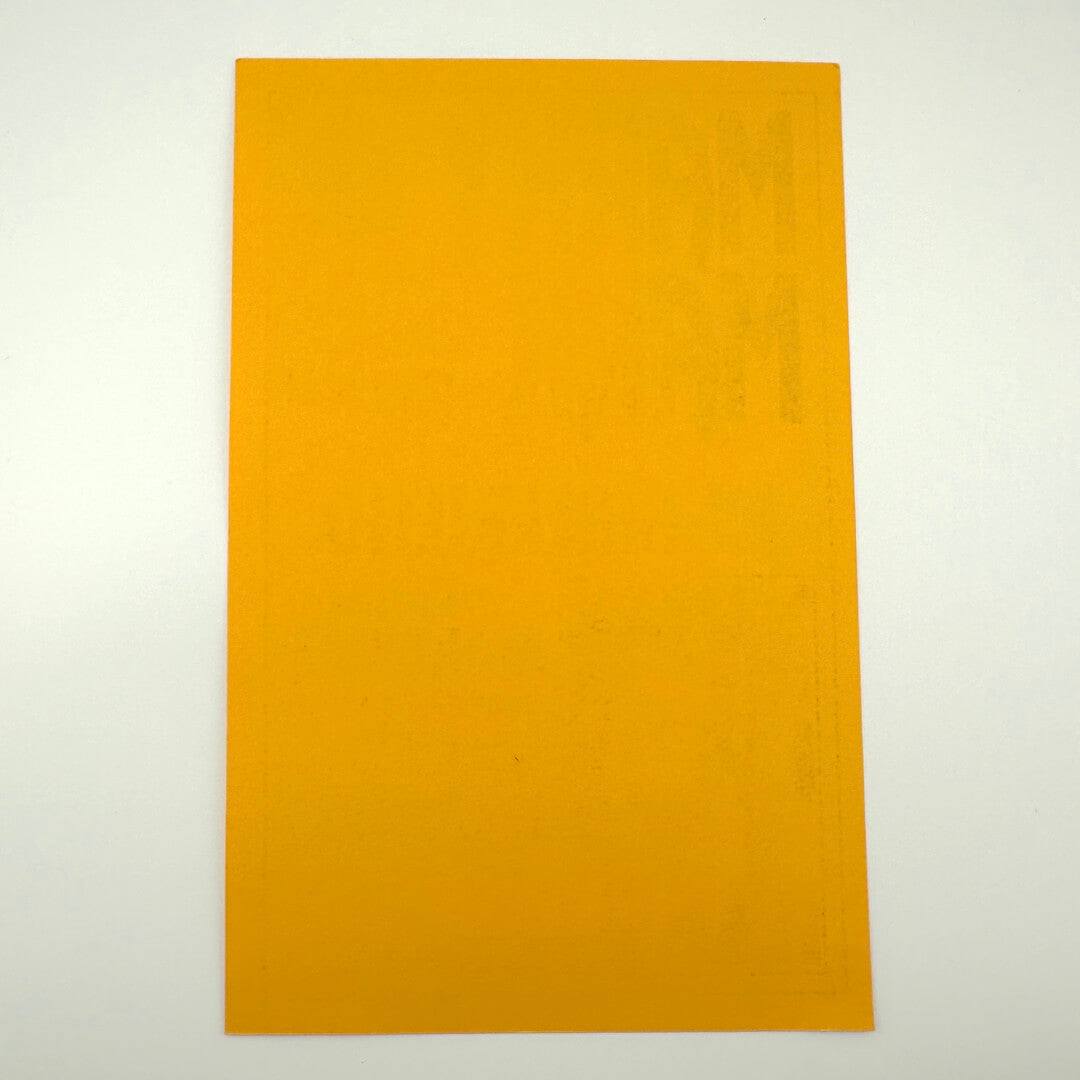 Backside of vintage handbill to show pristine condition against white background. 