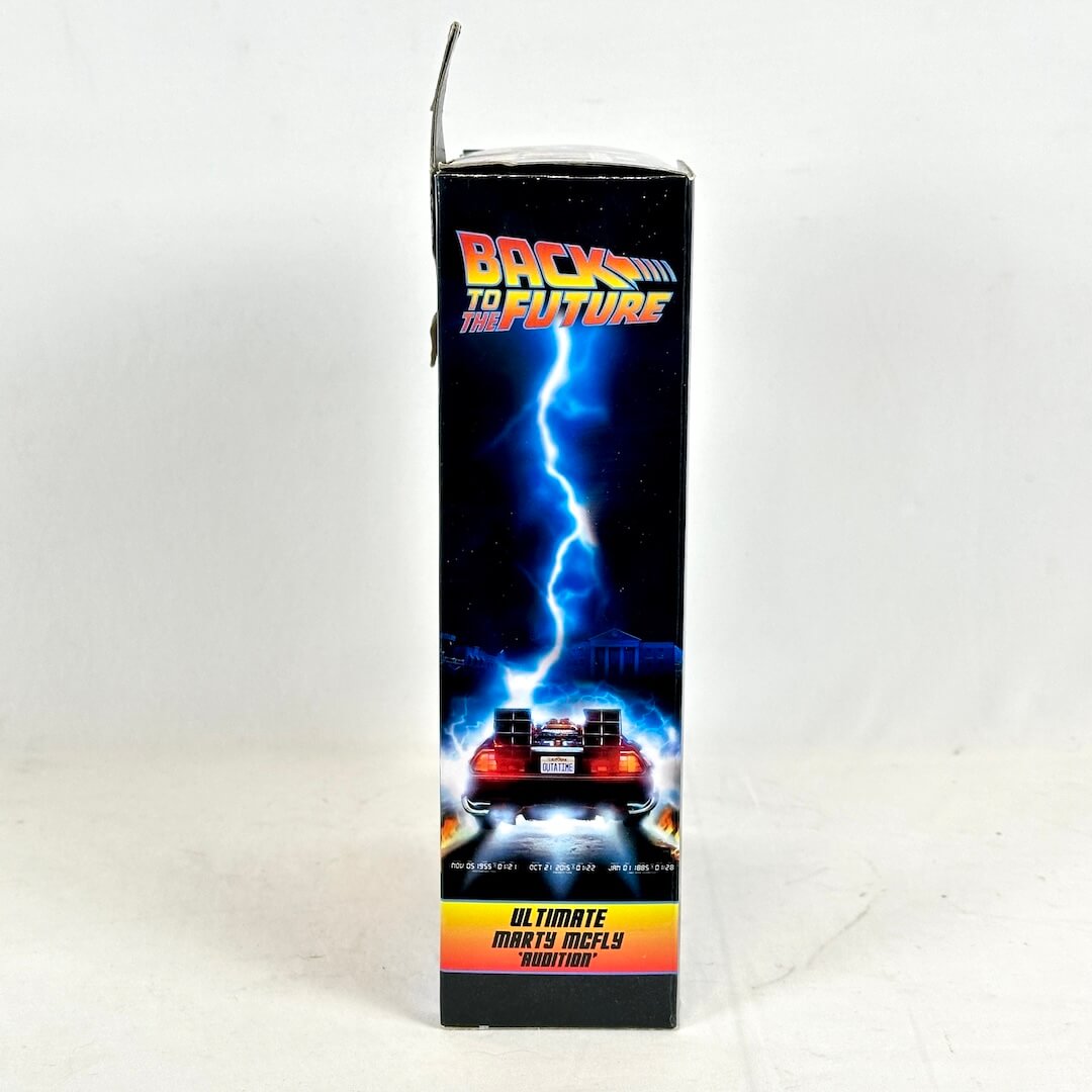 Box for 'Back to the Future' toy car with lightning and DeLorean design on a white background