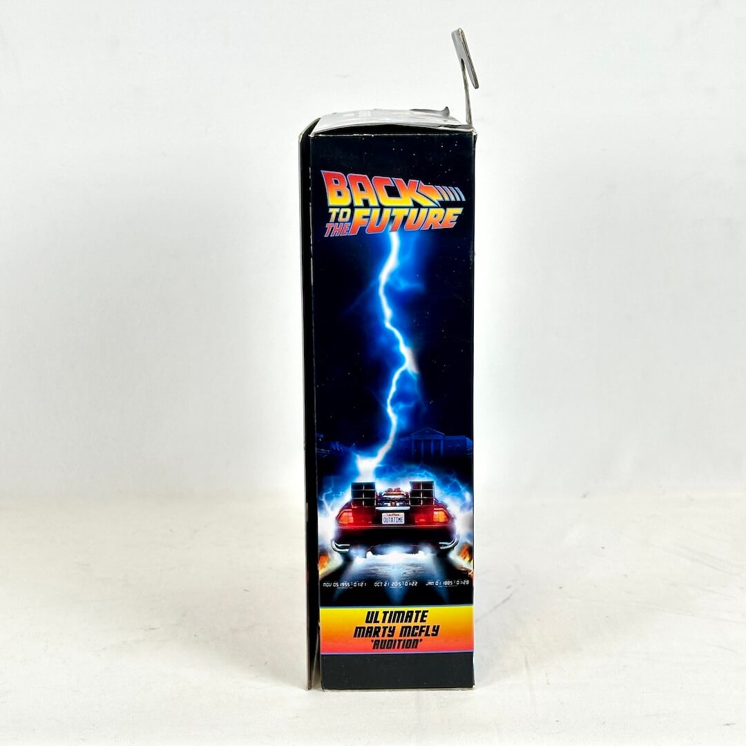 Back to the Future toy figure packaging with lightning and DeLorean design on a white background