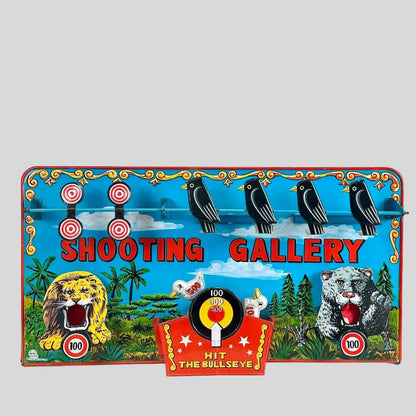 Vintage 'Shooting Gallery' toy with colorful graphics and animals on a white background