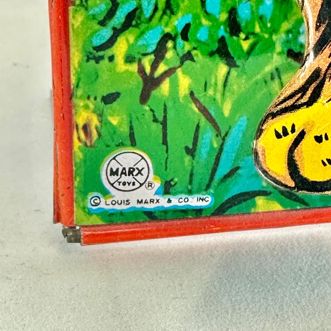 Toy with a tiger design and Marx branding on a white background