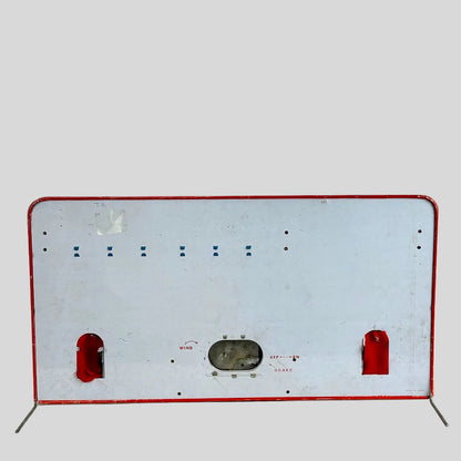backside of vintage shooting gallery toy against white background.
