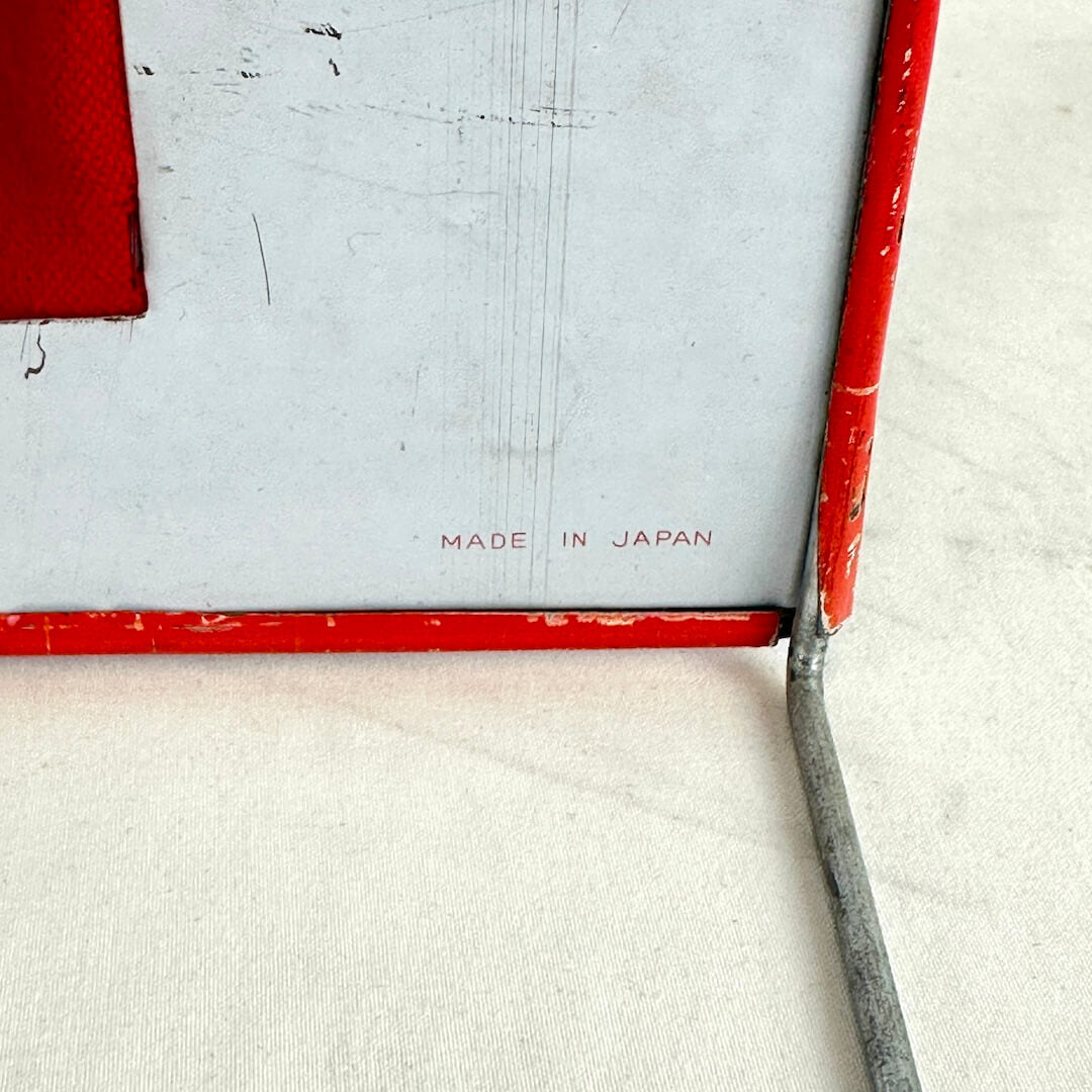 Red and white toy corner with 'MADE IN JAPAN' text on a light background