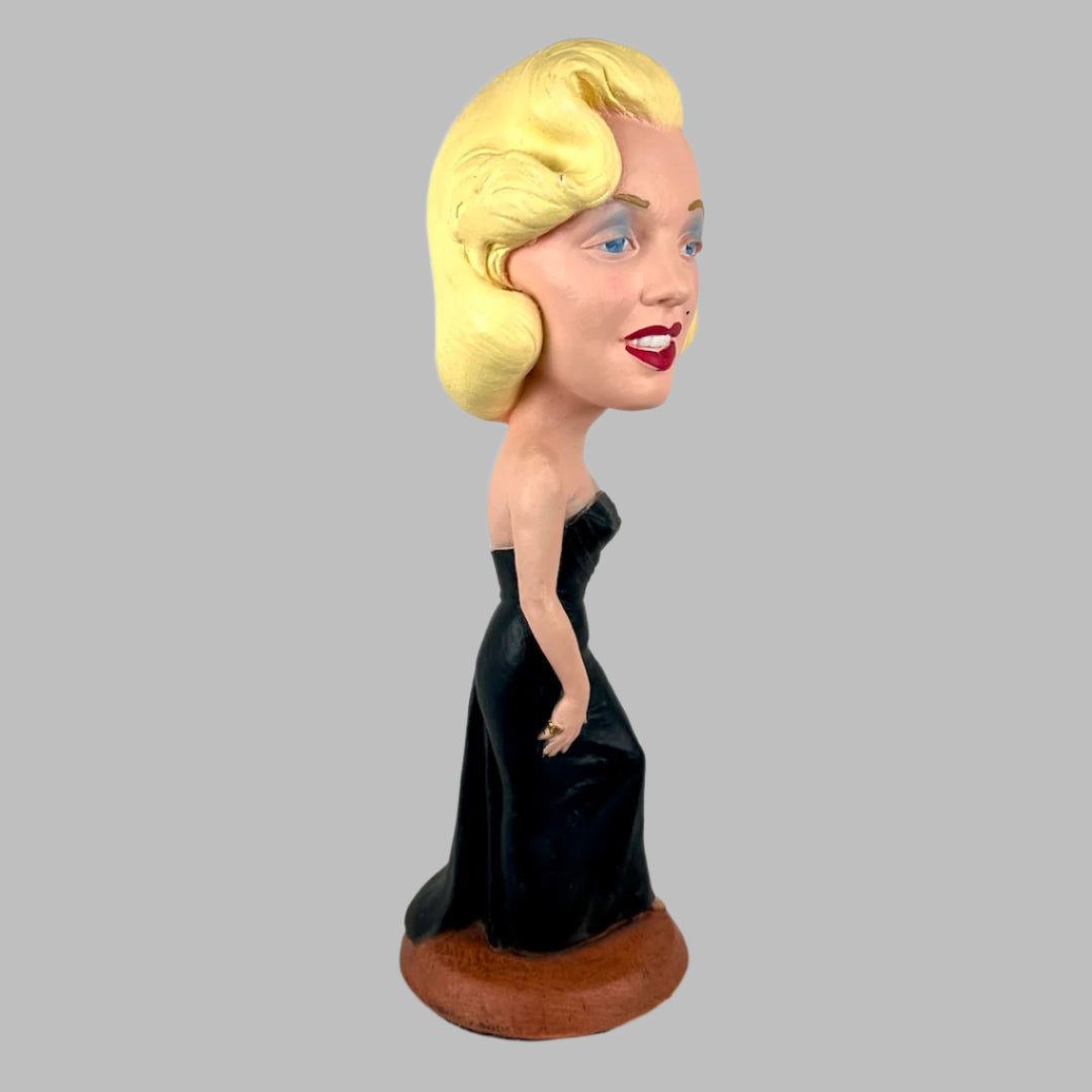 Chalkware figure of Marilyn Monroe in sleeveless long black dress, with red lipstick & blue eyeshadow. Right.