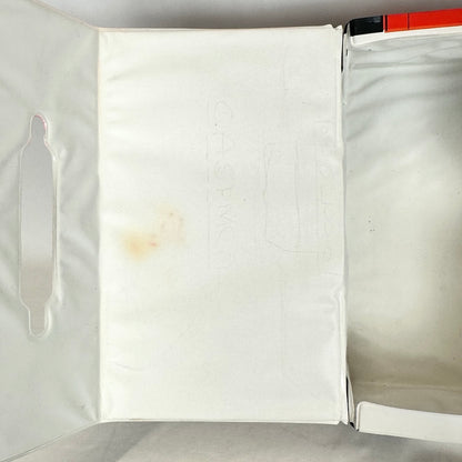 Image of interior of lid to show light pencil remnants and dirt stain by handle. 