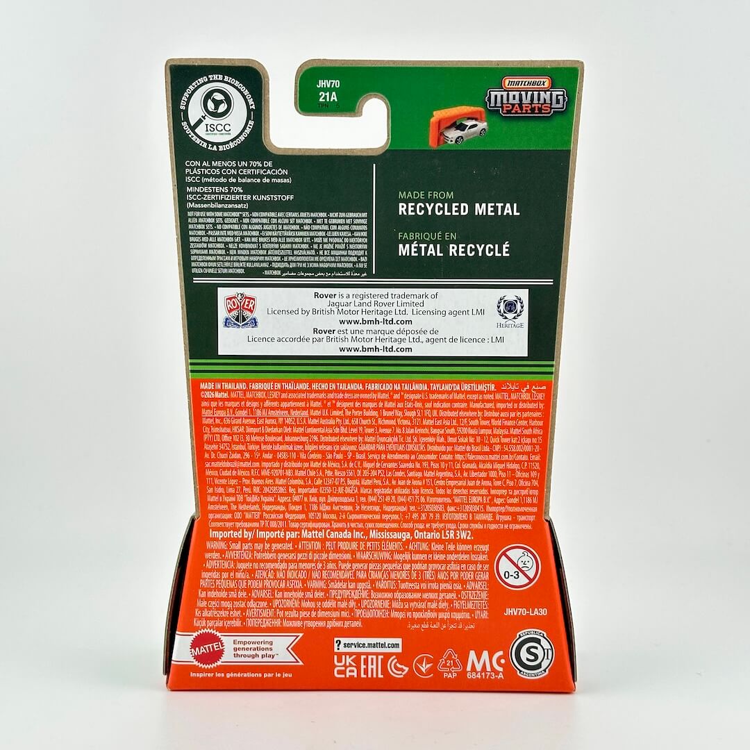 The back of a Matchbox toy car packaging card, featuring a green top section and a red-orange bottom section. 