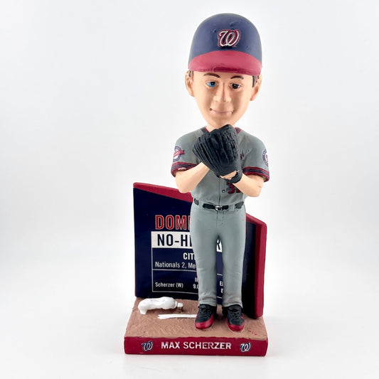 Bobblehead of a baseball player in uniform with a plaque on a white background