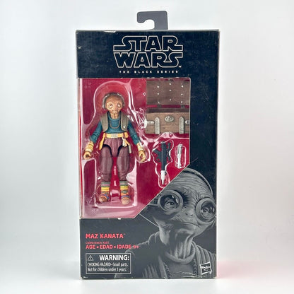 Star Wars Black Series action figure in its original window packaging; figure in brown with several accessories. 