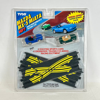 Tyco Mazda MX-5 Miata slot car set packaging with cars and track pieces.