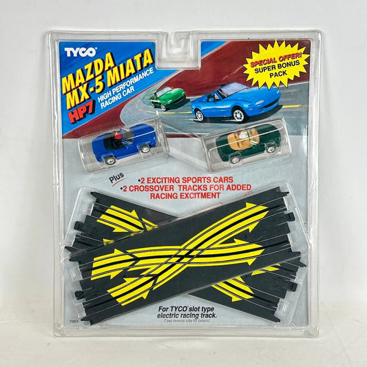 Tyco Mazda MX-5 Miata slot car set packaging with cars and track pieces.