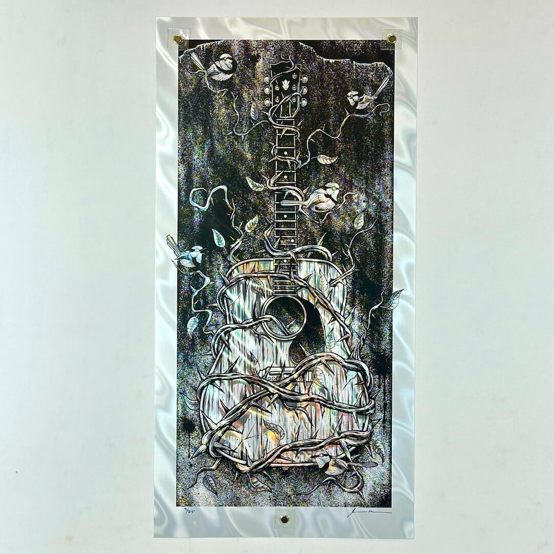 Poster of guitar covered in thorny vines on white lava foil paper. 