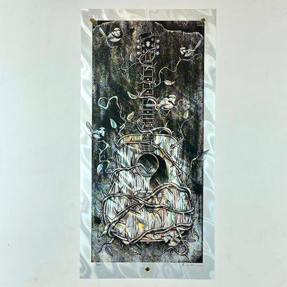 Poster of guitar covered in thorny vines on white lava foil paper. 