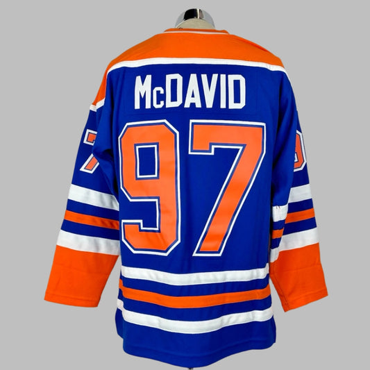Jersey blue body & long sleeves, orange shoulders, white/orange stripes around waist & wrists. McDAVID stitched nameplate & #