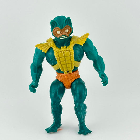 Turquoise male figure in orange loincloth with fur detail, and lime green battle harness accessory.