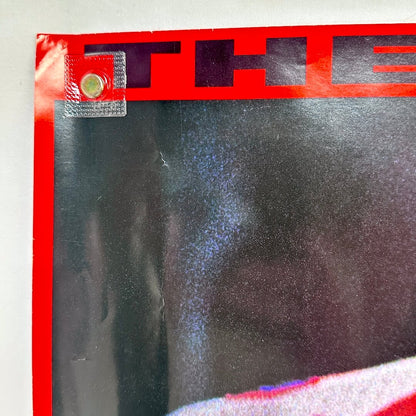Top left corner with some damage to corner. 