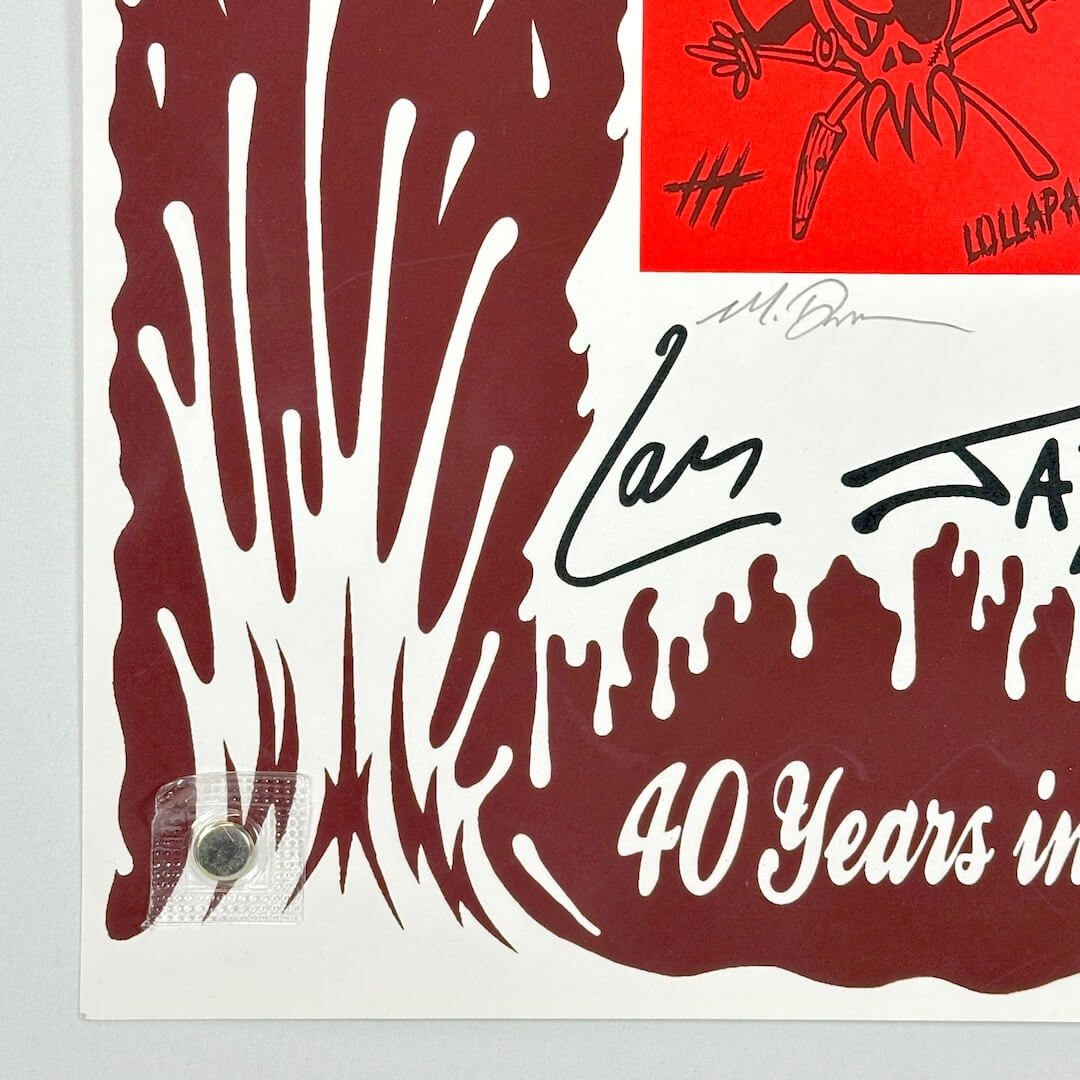 Bottom left corner of concert poster of white background. Artist signature in pencil visible. 