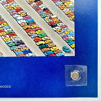 Colorful toy cars on a track with a blue border and clear square object in the foreground.