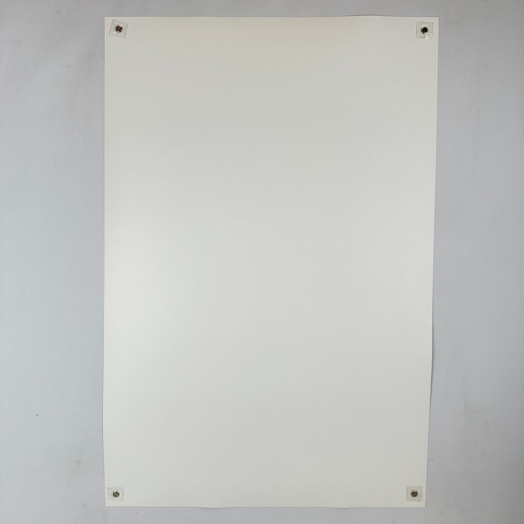 White sheet of paper on a gray background
