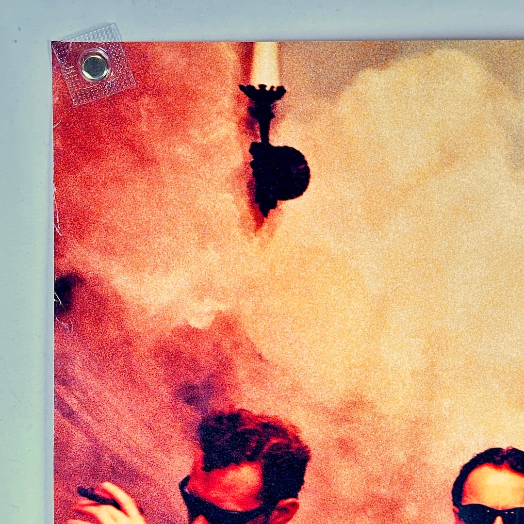 Top left corner of poster with some edge wear.