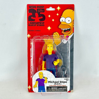 Action figure packaging featuring a character with no hair and a purple shirt, set against a red background with 'The Simpsons' branding.