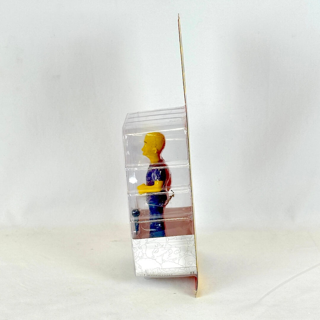 Clear plastic packaging with a colorful figure on a white background
