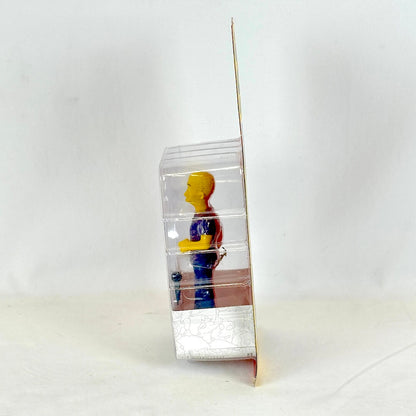 Clear plastic packaging with a colorful figure on a white background