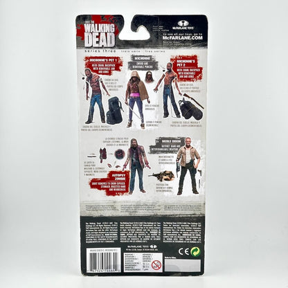 Back view of a McFarlane Toys 'The Walking Dead' action figure package, showing character details & product info.