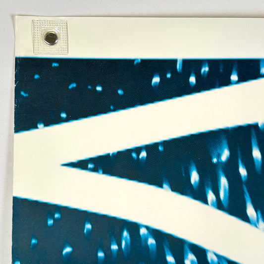 Close up of top left corner with wear to left edge. 