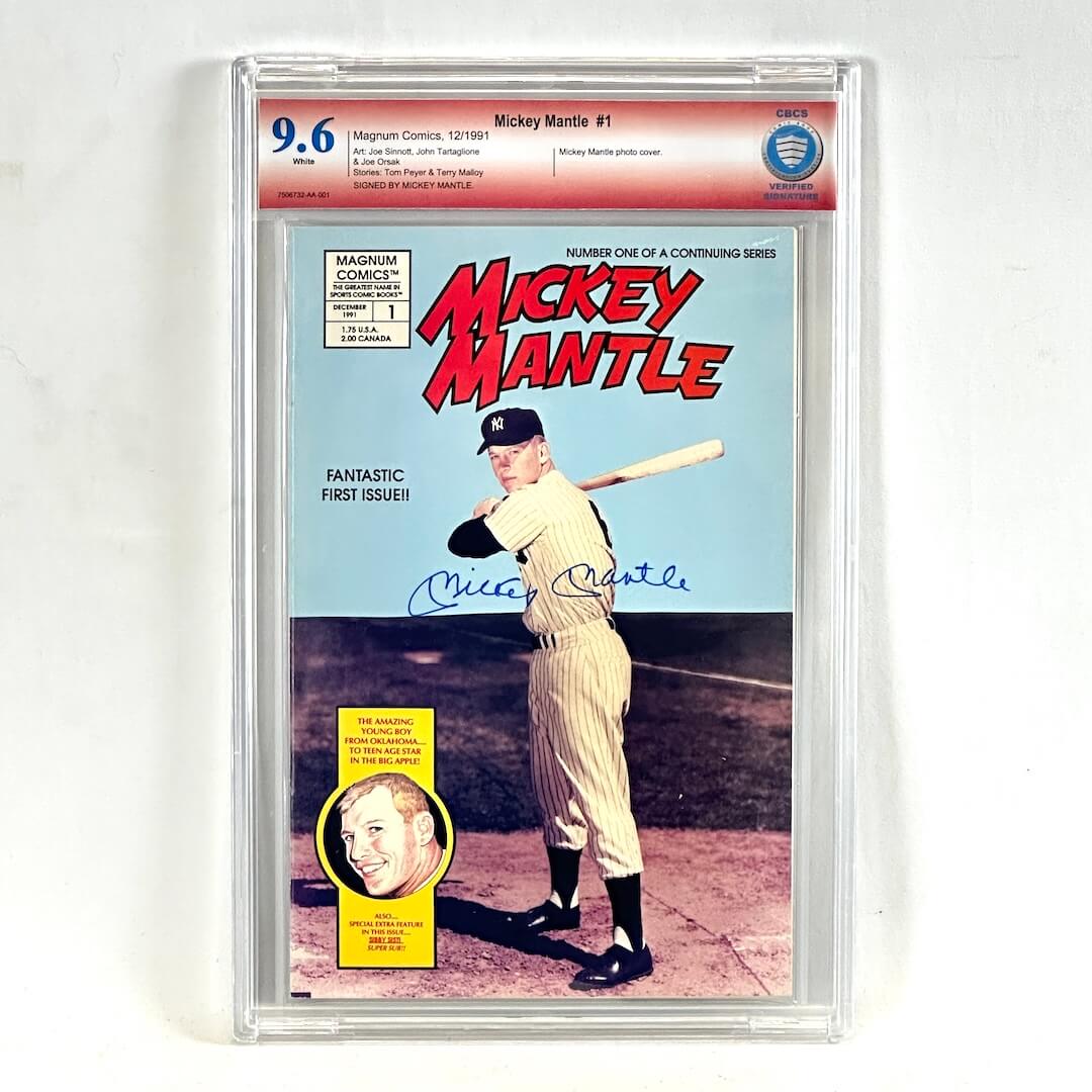 A graded, signed Mickey Mantle comic book in a clear plastic protective case. The comic features Mickey Mantle on the cover and is graded a 9.6.