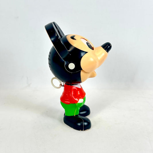 Vintage toy figure of a character with a black hat and red shirt on a white background