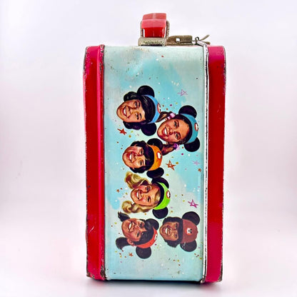 Side view of metal lunchbox with images of children's faces wear Mickey Mouse ears. 