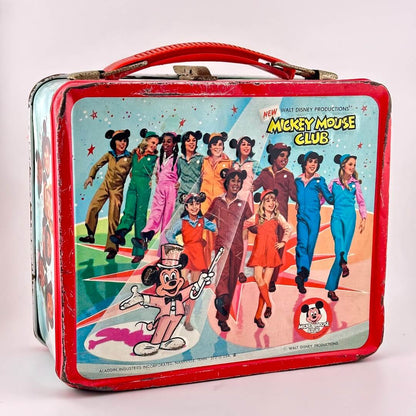 Mickey Mouse Club vintage lunchbox with red border and handle with image of dancing chorus line of kids wearing ears. 
