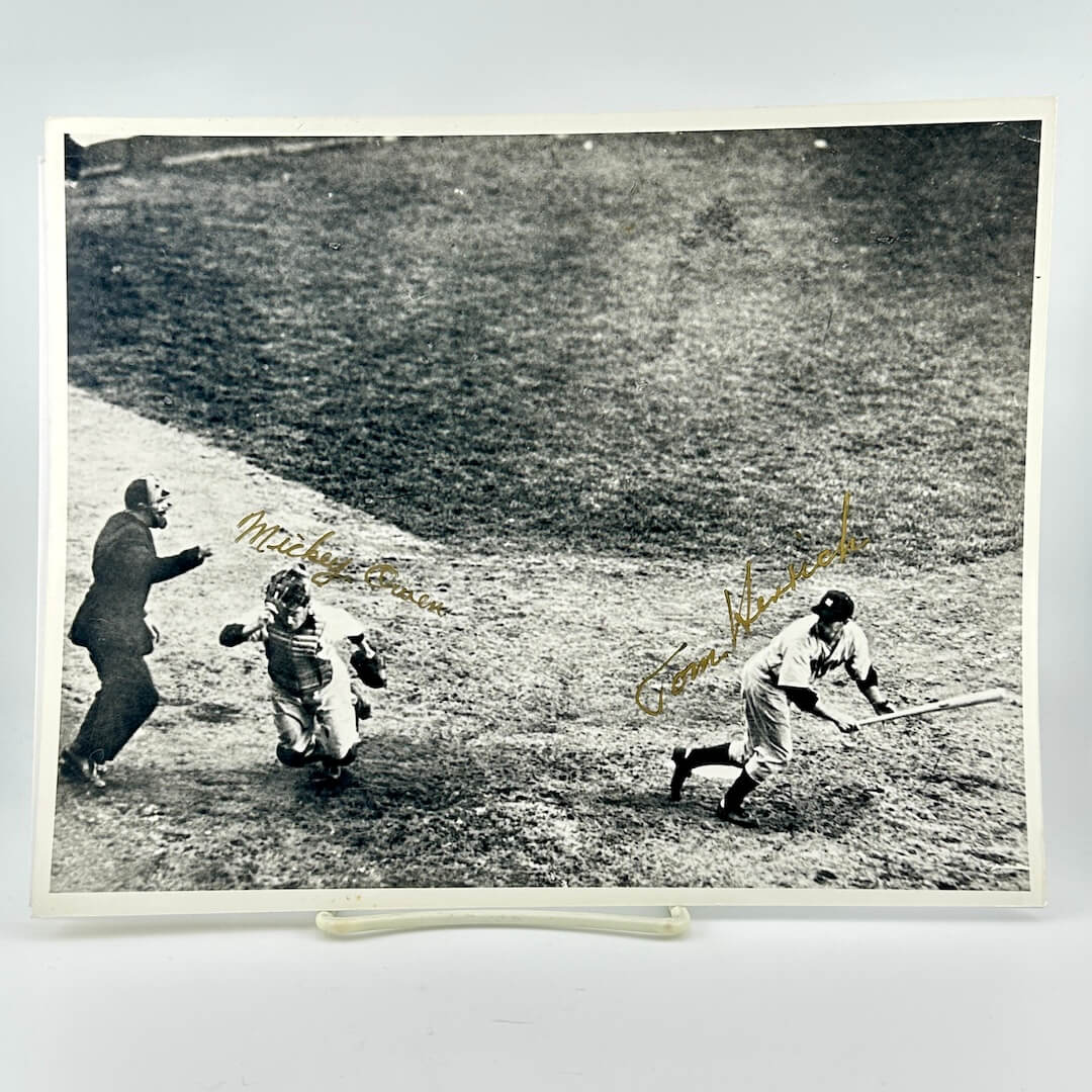 Black and white photo of a baseball game with signatures on it