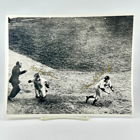 Black and white photo of a baseball game with signatures on it
