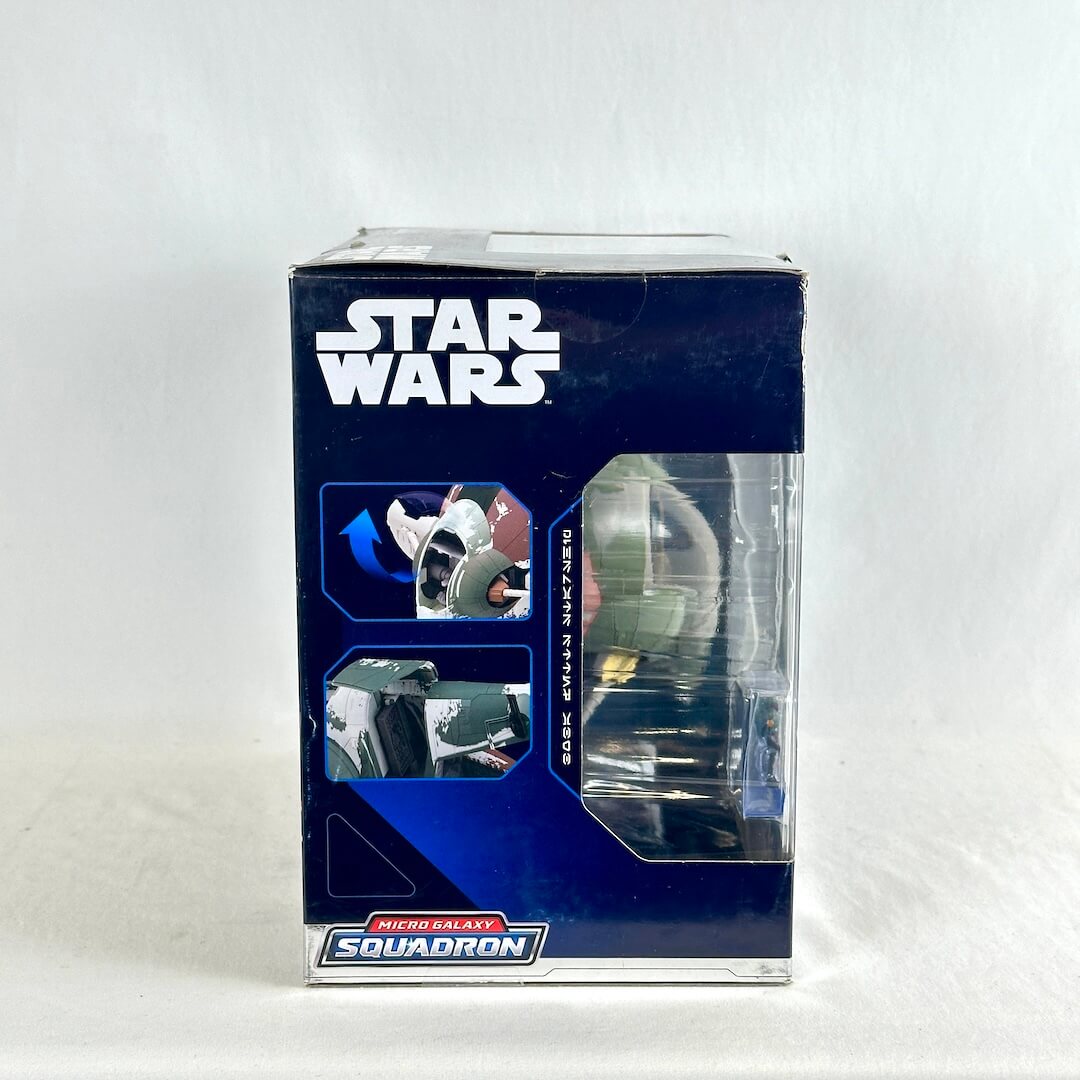 Side view of packaging containing toy spaceship. 