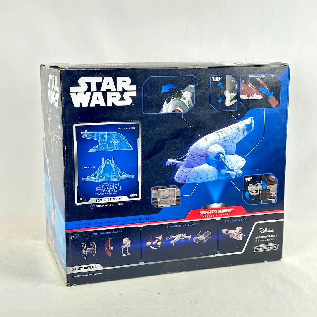 Back view of toy spaceship packaging with illustrated schematics and images of other available figures. 