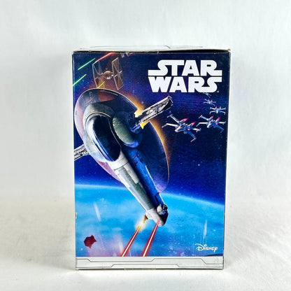 Side view of toy starship packaging with illustration of ship in space battle scene. 