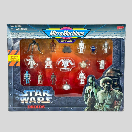 Box of Micro Machines Star Wars Droids figures with visible branding and product details.