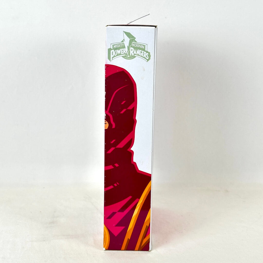 Side view of packaging with illustration of Pink Ranger under Power Rangers logo. 