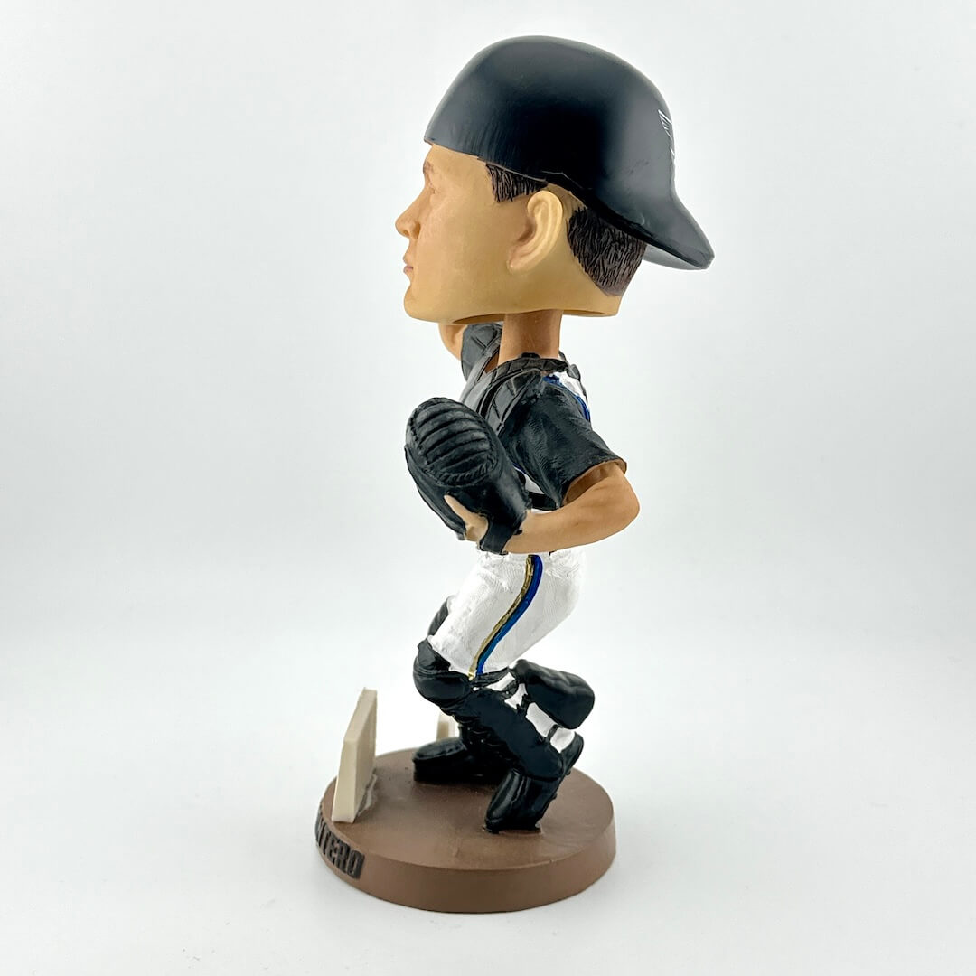 Bobblehead figure of a baseball player in a batting stance on a white background