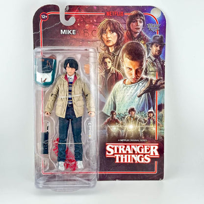 A Stranger Things Mike action figure in its original blister card packaging.