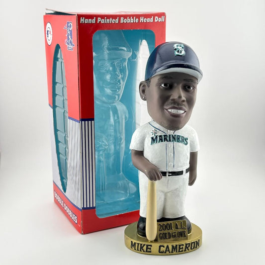 Bobble head doll of a baseball player in uniform with a bat, next to its packaging.