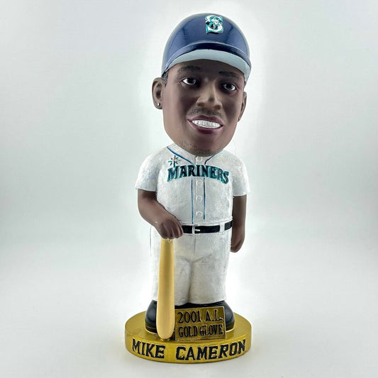 Bobblehead of a baseball player in a Mariners uniform with a bat, on a white background